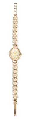 Lot 1379 - A 9 CARAT GOLD ROTARY BRACELET WATCH