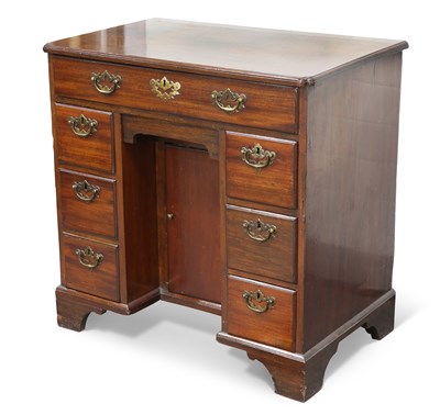 Lot 394 - A GEORGE III MAHOGANY KNEEHOLE DESK