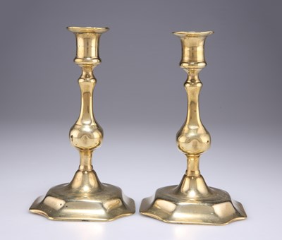 Lot 76 - A PAIR OF 18TH CENTURY CAST BRASS CANDLESTICKS