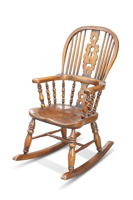 Lot 611 - A PERIOD STYLE ELM AND OAK CHILD'S ROCKING CHAIR