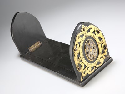 Lot 771A - A VICTORIAN BRASS-MOUNTED AND EBONISED BOOK SLIDE