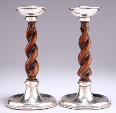 Lot 1275 - A PAIR OF GEORGE V SILVER AND OAK CANDLESTICKS