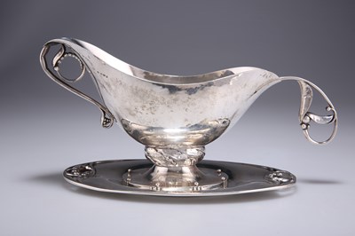 Lot 1045 - A GEORG JENSEN STERLING SILVER SAUCEBOAT, STAND AND LADLE
