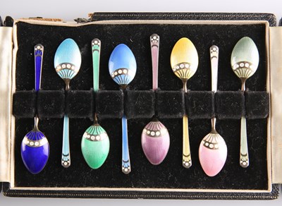 Lot 1321 - A SET OF EIGHT ELIZABETH II SILVER-GILT AND ENAMEL COFFEE SPOONS