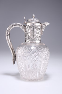 Lot 1358 - AN EDWARDIAN SILVER-MOUNTED CUT-GLASS CLARET JUG