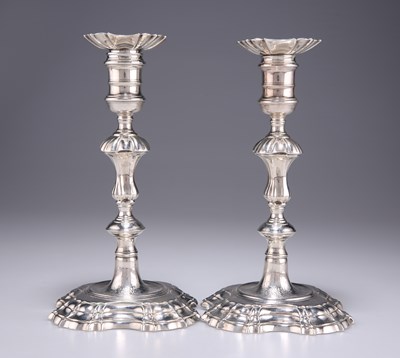 Lot 1296 - A PAIR OF GEORGE II CAST SILVER CANDLESTICKS