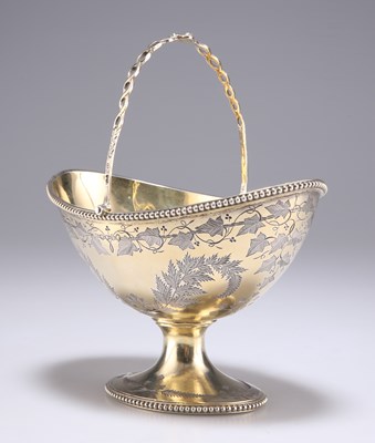 Lot 1305 - A VICTORIAN SILVER-GILT SWING HANDLE BASKET