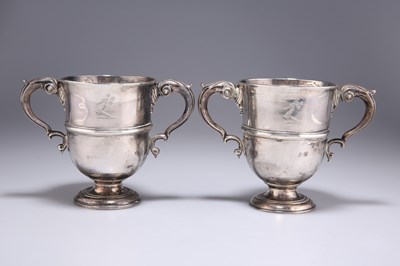 Lot 1079 - A PAIR OF MID-18TH CENTURY IRISH SILVER TWO-HANDLED CUPS