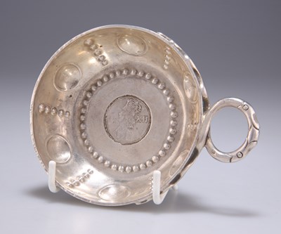 Lot 1317 - AN 18TH CENTURY STYLE SILVER TASTEVIN