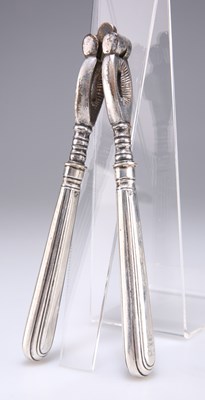 Lot 1304 - A PAIR OF GEORGE VI SILVER-HANDLED NUT CRACKERS