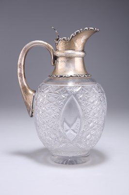 Lot 1294 - AN EDWARDIAN SILVER-MOUNTED CUT-GLASS CLARET JUG