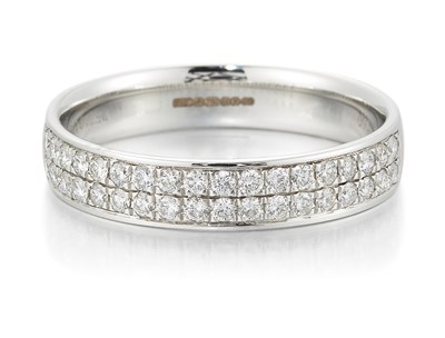 Lot 2047 - AN 18 CARAT WHITE GOLD DIAMOND HALF HOOP RING