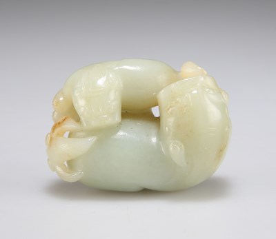 Lot 3053 - A CARVED JADE GROUP