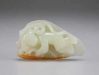 Lot 3086 - A CARVED JADE GROUP