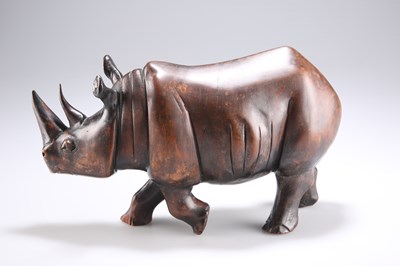 Lot 301 - AN EARLY 20TH CENTURY HARDWOOD MODEL OF A RHINOCEROS