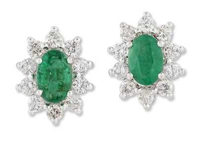 Lot 2011 - A PAIR OF EMERALD AND DIAMOND CLUSTER EARRINGS