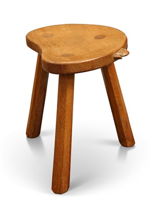 Lot 792 - ROBERT THOMPSON OF KILBURN, A MOUSEMAN OAK MILKING STOOL