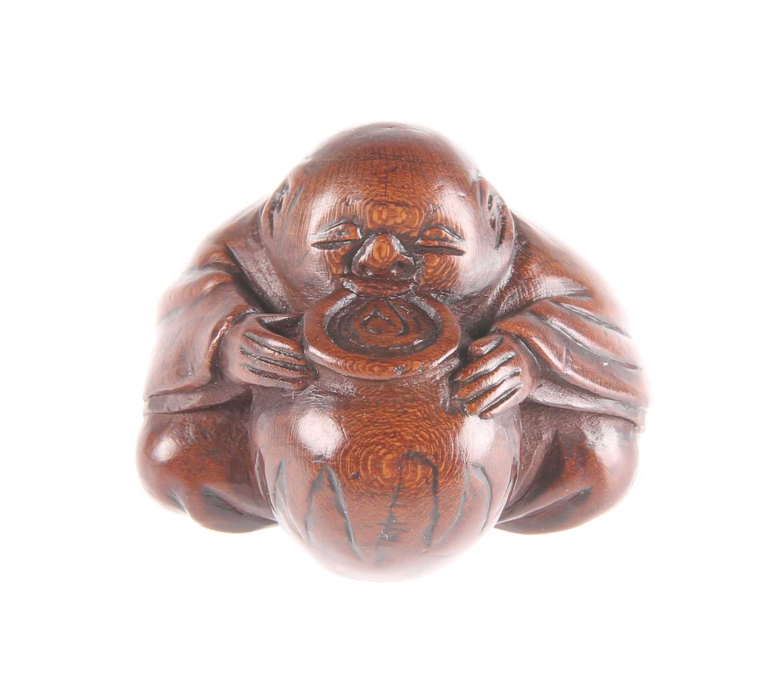 Lot 3044 - A JAPANESE WOODEN NETSUKE