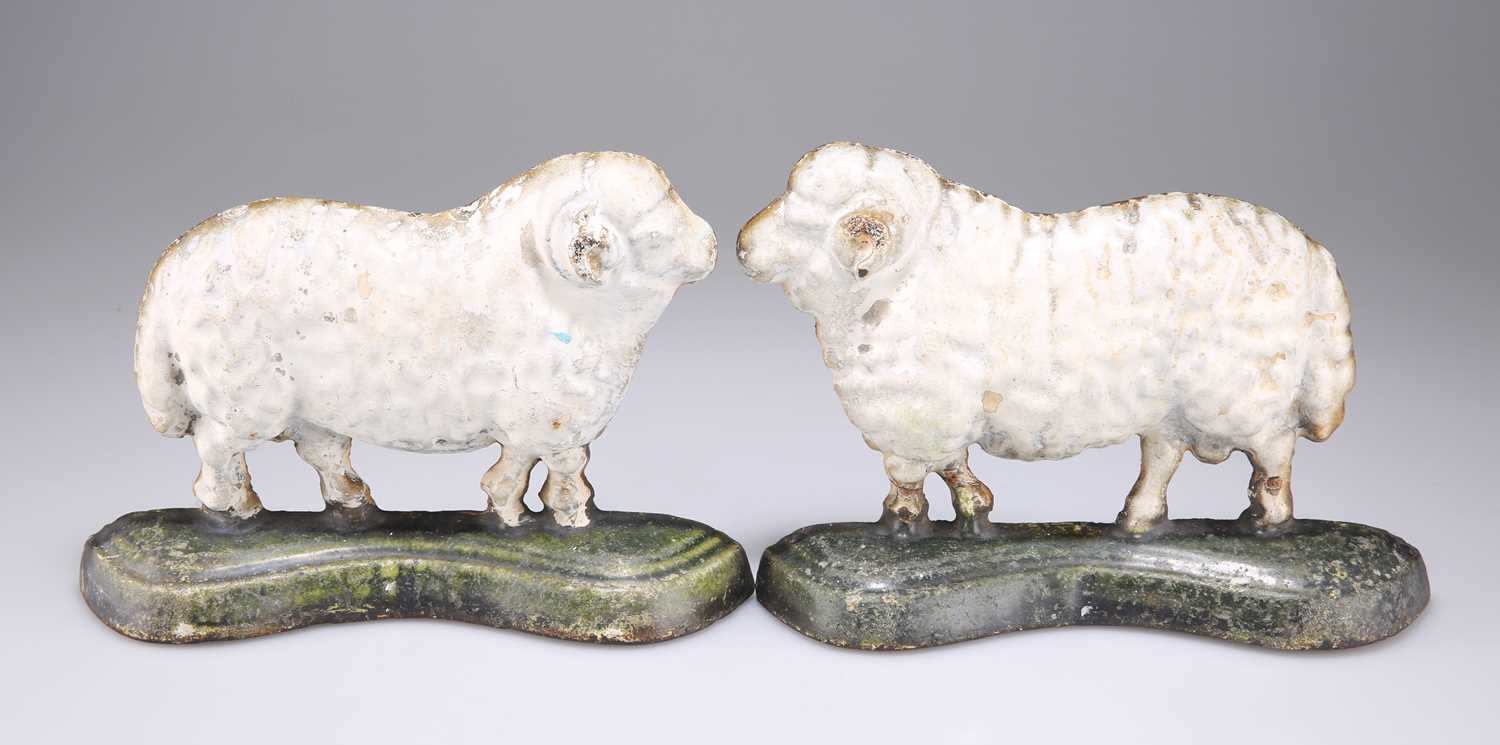 Lot 303 - A PAIR OF VICTORIAN PAINTED CAST IRON SHEEP DOOR STOPS