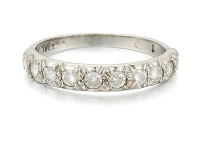 Lot 867 - A DIAMOND HALF HOOP RING