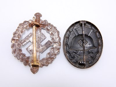 Lot 469 - A WW2 THIRD REICH WOUND BADGE, AND AN IRON SA SPORTS BADGE