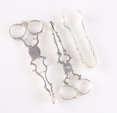 Lot 1268 - TWO PAIRS OF GEORGIAN SILVER SCISSOR SUGAR NIPS, AND A PAIR OF LATE VICTORIAN SILVER SUGAR TONGS