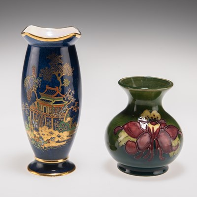 Lot 178 - A WILLIAM MOORCOFT 'COLUMBINE' PATTERN POTTERY VASE, AND A WILTSHAW AND ROBINSON CARLTON WARE VASE