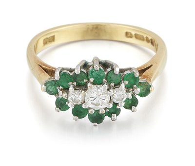 Lot 2348 - AN 18 CARAT GOLD EMERALD AND DIAMOND CLUSTER RING