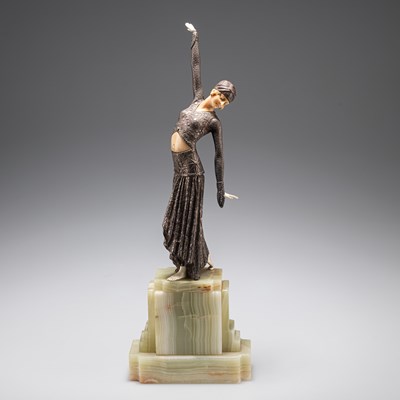 Lot 290 - AN ART DECO BRONZE AND FAUX IVORY FIGURE