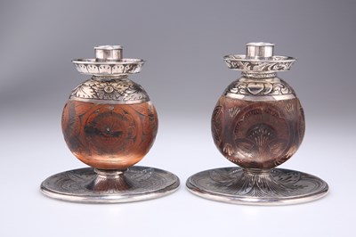 Lot 1012 - A STRIKING PAIR OF VICTORIAN SILVER-MOUNTED CHAMBERSTICKS