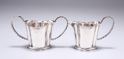 Lot 1101 - A GEORGE V SILVER TWO-HANDLED SUGAR BOWL AND CREAM JUG