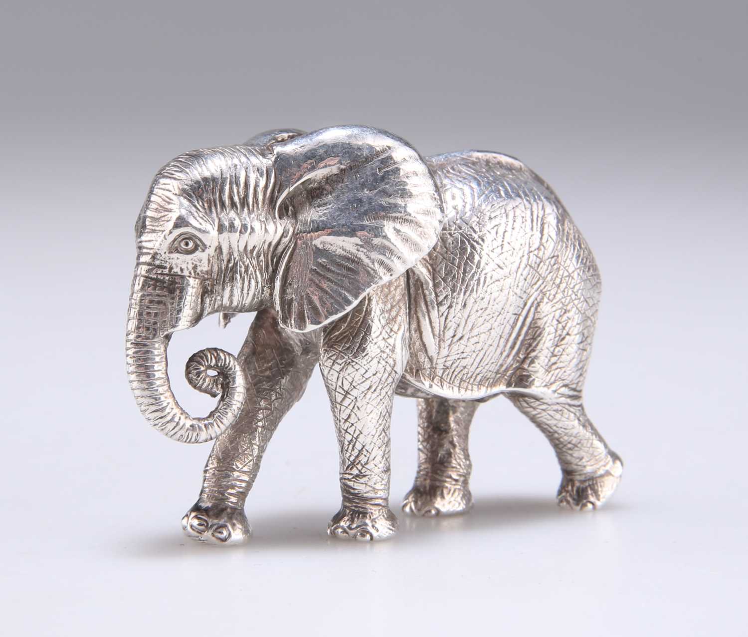 Lot 1143 - PATRICK MAVROS: A SILVER SCULPTURE OF A BOY CALF ELEPHANT, "HASHA"