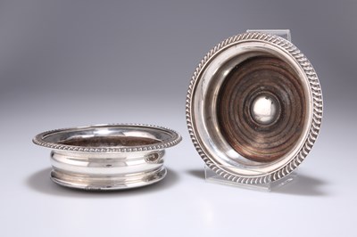 Lot 1246 - A PAIR OF GEORGIAN STYLE SILVER COASTERS