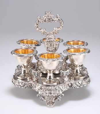 Lot 1054 - AN OLD SHEFFIELD PLATE EGG CRUET AND SIX CUPS, CIRCA 1835