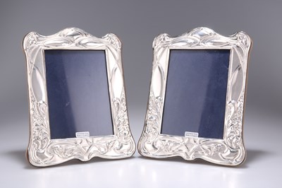 Lot 1149 - A PAIR OF ART NOUVEAU STYLE SILVER PHOTOGRAPH FRAMES