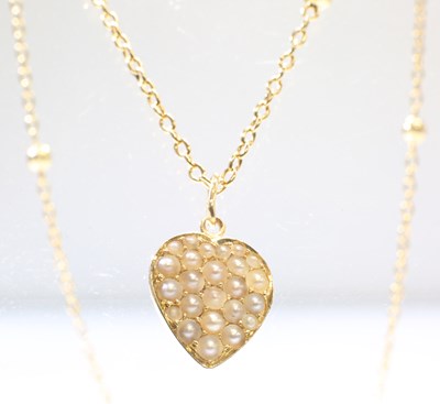 Lot 440 - A SEED PEARL PENDANT ON CHAIN