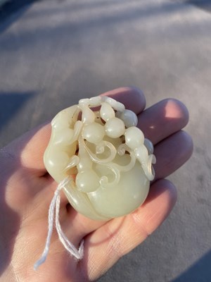 Lot 272 - A CHINESE JADE 'SQUIRREL AND GRAPES' GROUP