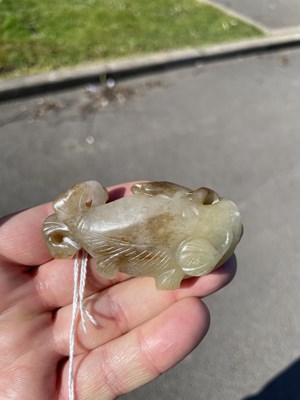 Lot 282 - A CHINESE JADE FISH PENDANT