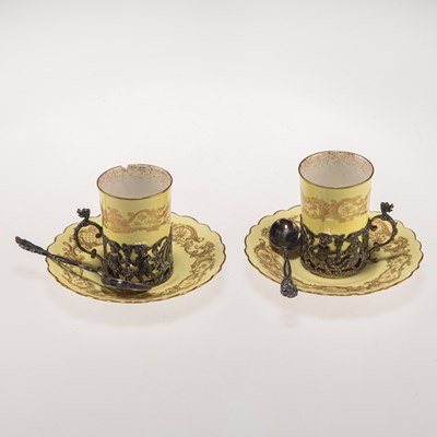 Lot 202 - A PAIR OF ROYAL WORCESTER SILVER-MOUNTED COFFEE CANS, WITH A PAIR OF SILVER SPOONS