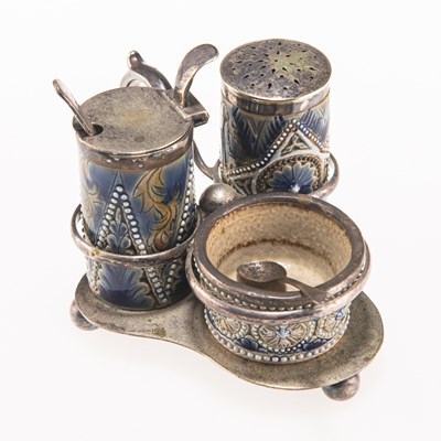 Lot 121 - A LATE 19TH CENTURY DOULTON LAMBETH SILVER-PLATE AND STONEWARE THREE-PIECE CRUET SET ON STAND