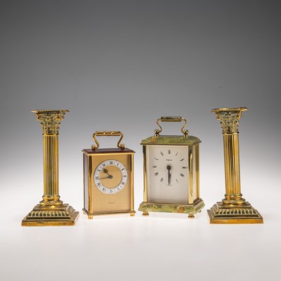 Lot 517 - TWO CARRIAGE CLOCKS, AND A PAIR OF BRASS CORINTHIAN COLUMN CANDLESTICKS