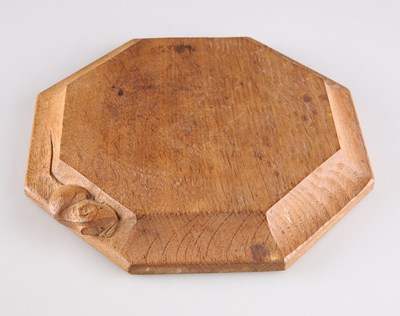 Lot 789 - ROBERT THOMPSON OF KILBURN, A MOUSEMAN OAK TEAPOT STAND/SMALL CHOPPING BOARD