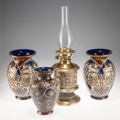 Lot 136 - A LATE 19TH CENTURY DOULTON LAMBETH STONEWARE PEDESTAL OIL LAMP, AND THREE VASES