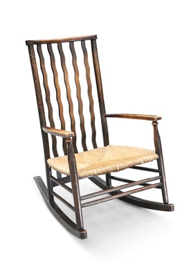 Lot 712 - ATTRIBUTED TO MORRIS & CO FOR LIBERTY, A RUSH-SEATED ROCKING CHAIR