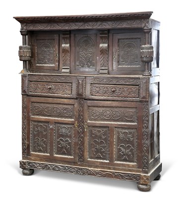 Lot 1240 - A LARGE CARVED OAK COURT CUPBOARD