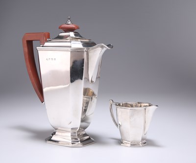 Lot 244 - A GEORGE VI SILVER HOT WATER JUG AND CREAM JUG