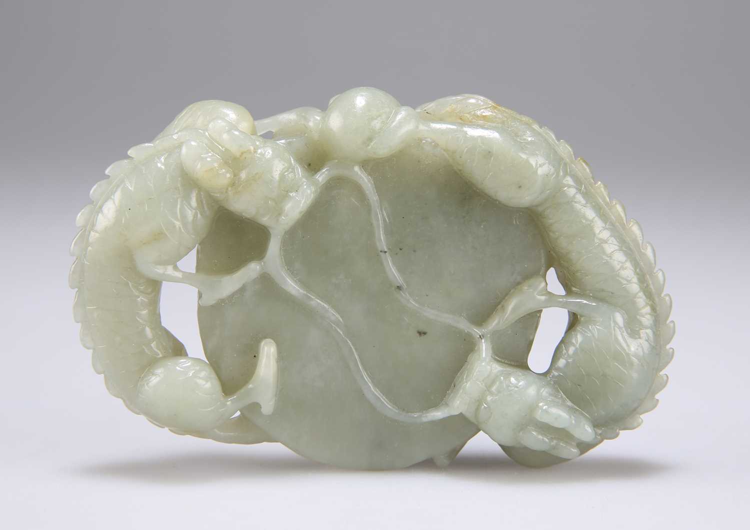 Lot 640 - A CHINESE JADE DRAGONS DISC