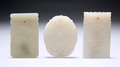 Lot 667 - THREE CHINESE JADE PENDANT PLAQUES