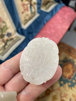 Lot 667 - THREE CHINESE JADE PENDANT PLAQUES