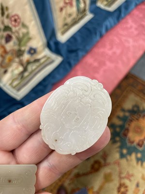 Lot 667 - THREE CHINESE JADE PENDANT PLAQUES